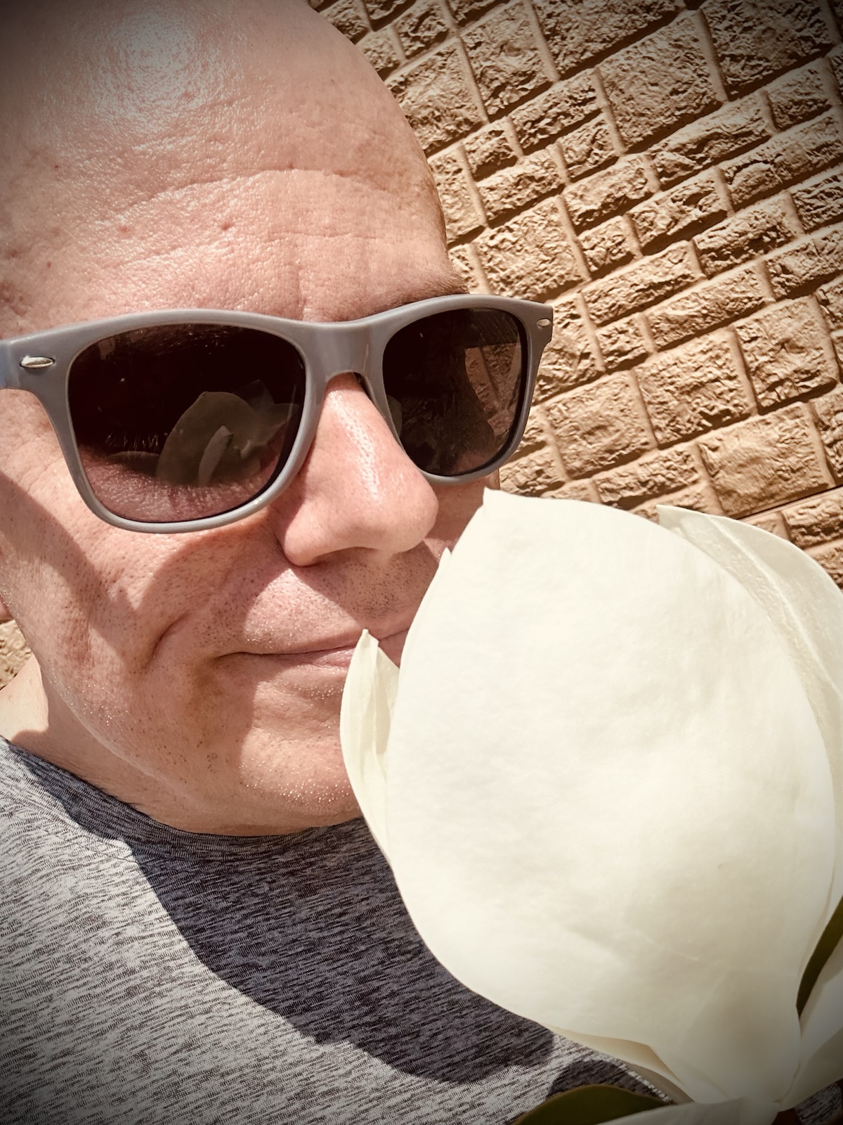 Selfie while smelling the magnolia blossom