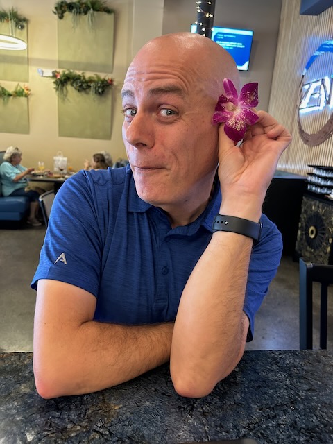 Portrait of my wearing a flower on my ear