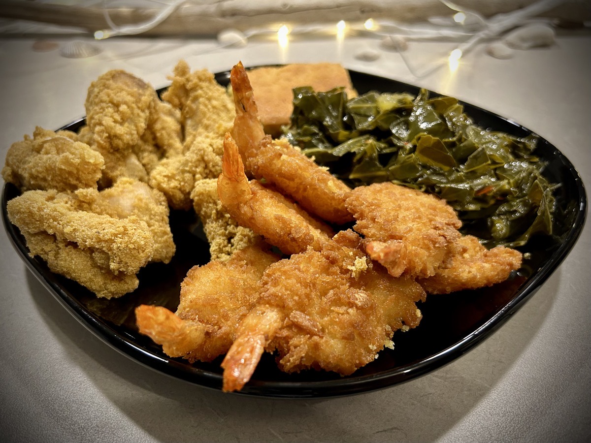 Plate of catfish, shrimp and collard greens