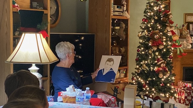 Grandma looking at the painting
