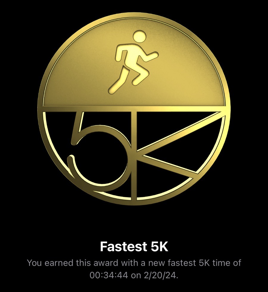 Computer generated medal showing that I achieved a new record time for a 5K at 00:34:44 on 2/20/24