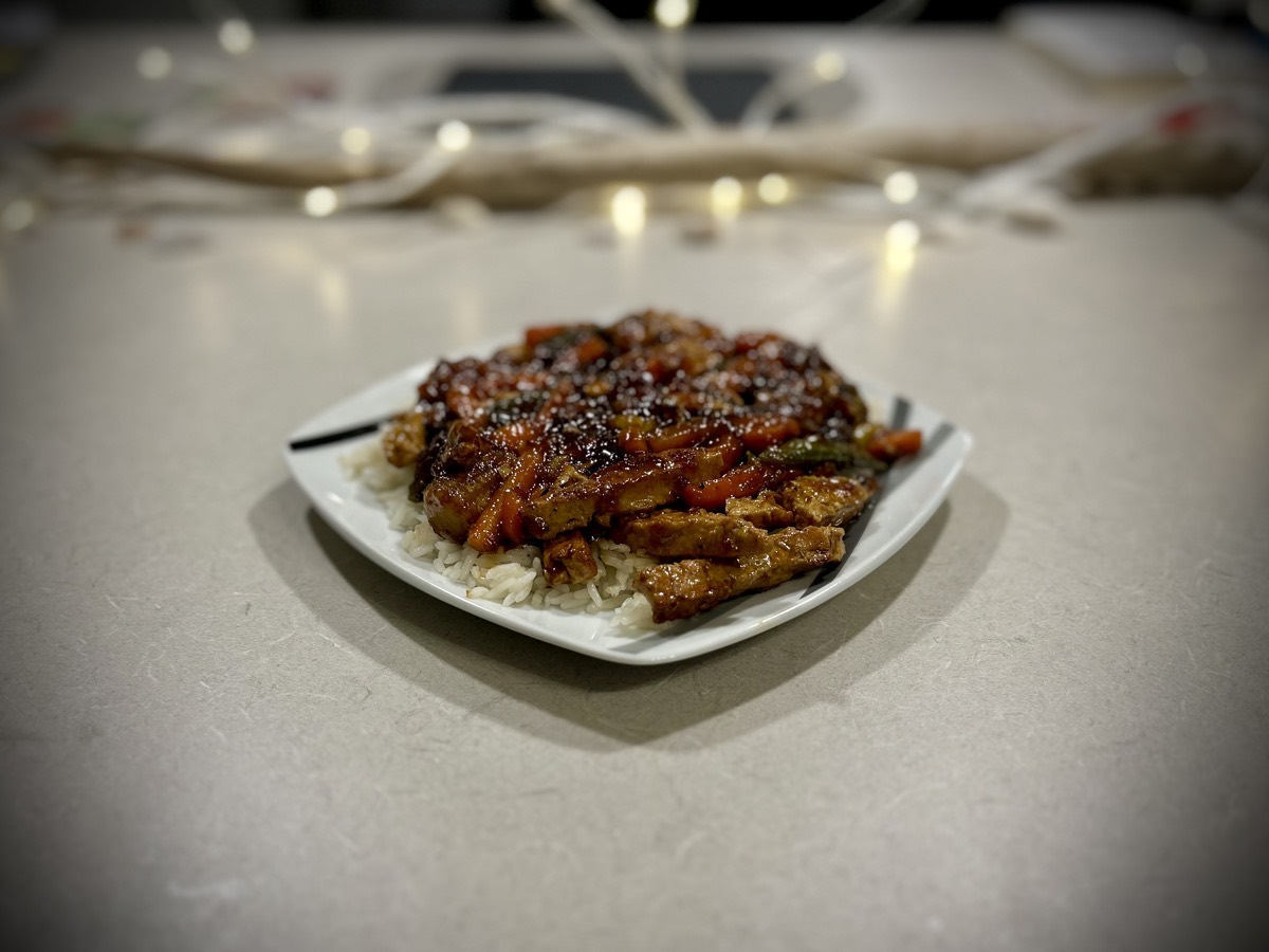 Plate of plant-based "chicken" stir fry