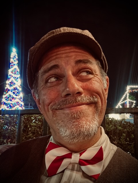 Selfie looking up and off into the distance.